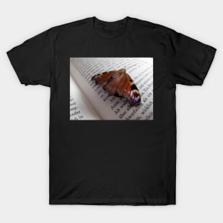 Butterfly resting on an open page of a book T-Shirt